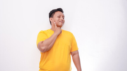 Young Asian fat men gesturing sign language on isolated background