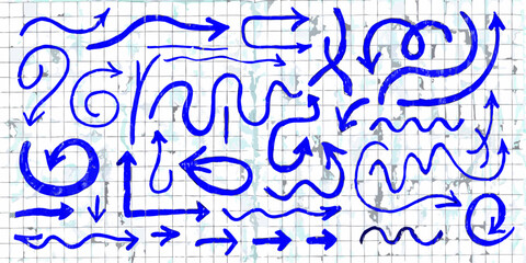 Collection of hand drawn blue arrows in various shapes and directions on a textured background