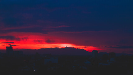 Sunrise colors painting the sky in tranquil tones.