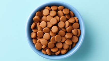 Bowl of Round Brown Cookies on Blue Surface