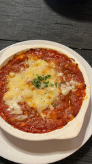 Ravioli pasta italian with meat and tomato sauce and basil. Homemade italian ravioli for dinner
