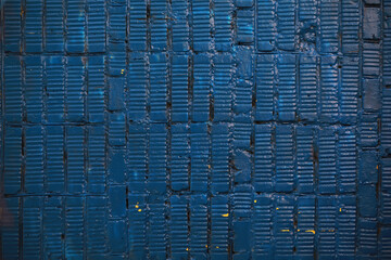 Textured Blue Wall with Rectangular Pattern and Subtle Highlights