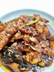 Close-Up Shot of Indonesian Chicken Thighs Braised in Sweet Soy Sauce and Nutmeg