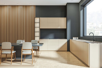 Stylish kitchen with beige cabinetry, wood slat wall, marble countertops, and dining table with chairs in modern minimalist design on bright interior background. 3D Rendering