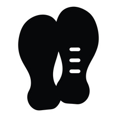 Black silhouette of two shoe soles, simple illustration style, white background