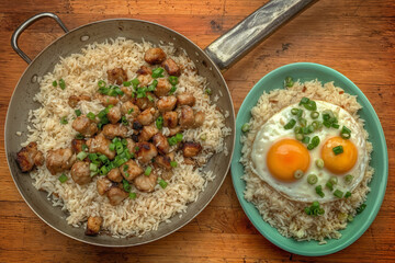 White rice with stewed meat, herbs and fried eggs, drizzled with aromatic sauce. An elegant Asian dish.