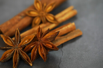 Star Anise and Cinnamon Sticks on Slate Background: Aromatic Spices in Modern Culinary Photography