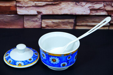 Elegant floral pattern sugar bowl with lid, a vibrant addition to your kitchenware collection, perfect for adding charm and a touch of springtime freshness