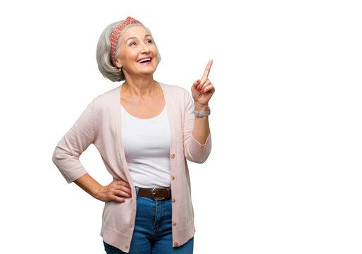 Smiling senior woman pointing up isolated on transparent background