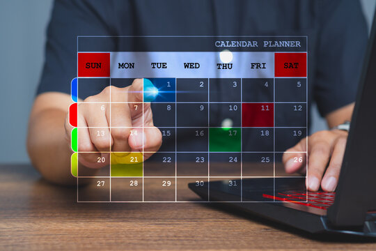 Man planning work schedule on virtual digital calendar.