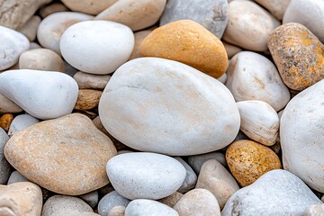 Collection of Smooth River Stones in Varying Shades of White, Grey, and Beige Tones