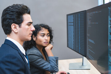 Two programmer is dealing with the stress and anxiety of working on computer code at the office.