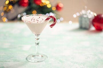 White chocolate  martini cocktail with candy cane. Christmas drink