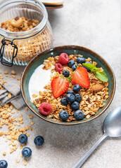 Healthy breakfast granola bowl with fresh berries