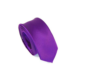 Slimfit necktie rolled on white background close-up view, Purple color tie isolated on white background 