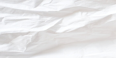 Abstract white crumpled paper texture background with sharp creases, shadows, and copy space, a blank canvas for design.
