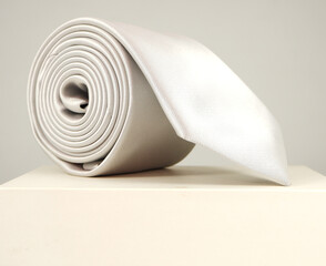 Necktie rolled on gift box closeup view 