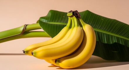 Ripe Yellow Bananas With Green Leaf On Beige Background