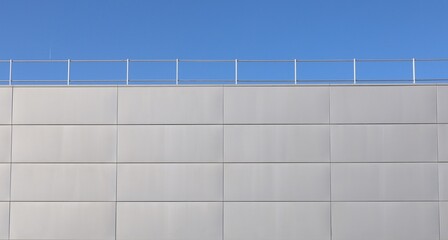 Aluminium panel cladding for ventilated facade with railing and sky on top. Background and texture.