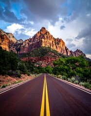 Mountain road stretches into dramatic sky