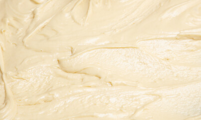 A bowl of batter is being mixed