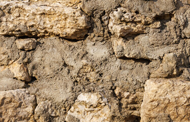 A wall made of rocks and dirt
