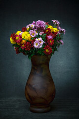 Still life with a bouquet of chrysanthemums in a vase