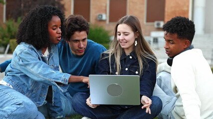 Diverse students collaborating on laptop outdoors at university campus - Powered by Adobe