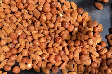 Scattered almonds and hazelnuts glisten under autumn's sun, symbolizing harvest abundance and the niche festival of Fornacalia