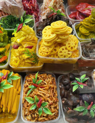 An eclectic rainbow of pickled delights, featuring vibrant lotus root and fiery chili, perfect for Lunar New Year celebrations