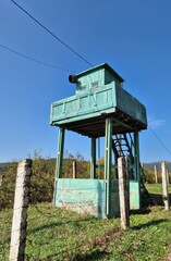 A weathered wooden outpost stands sentinel, evoking rustic solitude, perfect for National Nature Day and Heritage Watchtower Appreciation Week