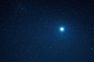 Fototapeta premium A Majestic View: Shimmering Stars Illuminate a Deep Blue Night Sky, Symbolizing Limitless Exploration