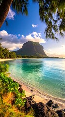 Scenic beach view with mountain in the background, palm trees and clouds