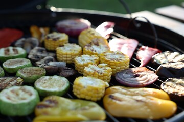 Vegetarian barbeque. Many different cooked vegetables on grill, closeup