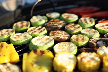 Vegetarian barbeque. Many different cooked vegetables on grill, closeup