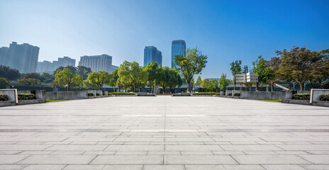 Serene Urban Park with Modern Architecture and Clear Blue Sky