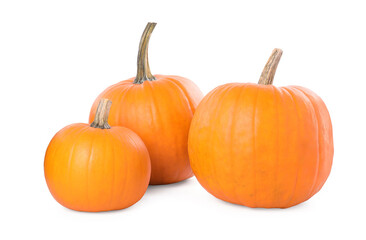 Obraz premium Three whole ripe pumpkins isolated on white