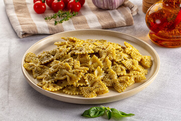 Italian green pasta farfalle with pesto