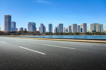 Modern City Skyline with Clear Blue Sky and Serene Waterfront