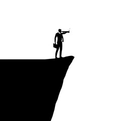Silhouette of a businessman standing on a cliff, looking through a telescope.