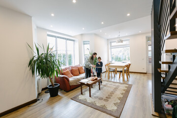 Mother and a boy playing music together