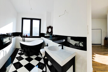 Nowoczesna łazienka w czarno-białej kolorystyce. Minimalistyczny wystrój, eleganckie wykończenia i kontrastowe detale tworzą stylową, ponadczasową przestrzeń. Idealne wnętrze dla miłośników prostoty i © Freshfanpage