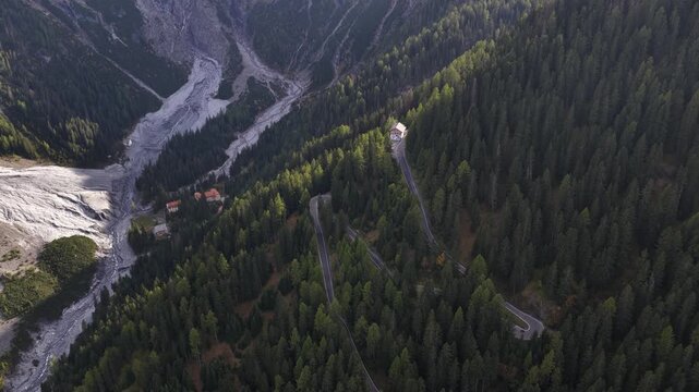 Stelvio pass, Italy, Mountain pass at the swiss italian mountains. Serpentine roads in the alps. Revealing aerial video.