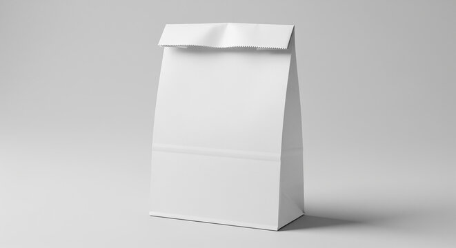 White paper bag standing upright on a neutral gray background, showing a clean and simple design with a folded top.