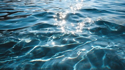 Rippling blue water captures sunlight, creating a serene and calming atmosphere by the waterfront during early afternoon hours