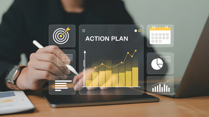 Man using digital tablet to review action plan with growth charts and business icons on screen