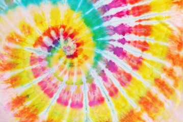 colorful spiral tie dye pattern fabric texture background.