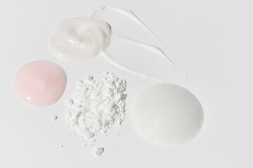 Soft pastel cream smears composition on empty background