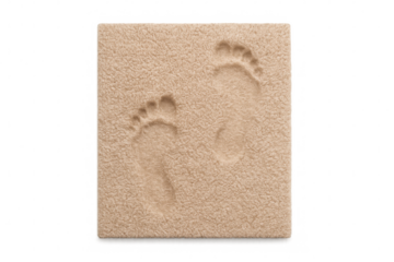Bare footprints impressing into soft beige memory foam cushion, showing comfort and relaxation