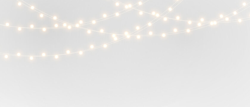 Elegant string lights overlay on black and white backgrounds, glowing warm garland creating festive atmosphere for Christmas decoration and celebration projects.	